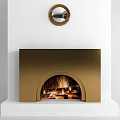 Golden Modern Fireplace With Arched Opening And Burning Fire Below Round Mirror