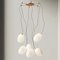 Modern Artistic Chandelier With White Stone Like Pendants On Black Hanging Wires For Interior Spaces