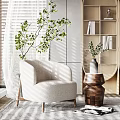 Beige Upholstered Armchair With Wooden Legs In Natural Light Near Green Plants And Wooden Shelves