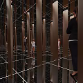 Amusement Park Mirror Maze Featuring Wooden Signs And People Exploring Fun Activity
