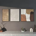 Three Panel Wall Art with Geometric Line Textured Designs on Gray Wall and Table Decor 3d model