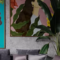 Modern Sectional Sofa with Decorative Pillows Green Plants and Wall Art