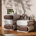 Modern White And Brown Dresser With Curved Drawers Decorative Vase Photo Frame And Green Plant