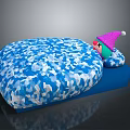 Blue Cushion Featuring White Geometric Pattern And Small Doll With Pink Hat
