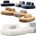 Curved Modular Sectional Sofa with Neutral Blue Upholstery Decorative Pillows and Throw Blanket