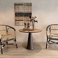 Rattan Leisure Chairs with Round Wooden Table and Woven Wall Tapestry on Wooden Floor