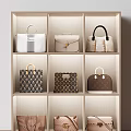 Luxury Designer Handbags Displayed On Beige Shelves With Classic Styles And Patterned Details