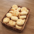 Fresh Homemade Dinner Rolls Displayed in Wicker Basket on Wooden Table