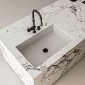 Modern Black Faucet With Flexible Spout On White Marble Countertop Sink