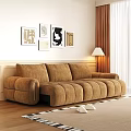 Large Brown Multi Seat Sofa In Living Room With Decorative Paintings And Floor Lamp