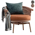 Lounge Chair With Wicker Armrests Orange Cushion Navy Blue Pillow And Striped Throw