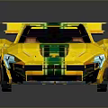 Yellow Sports Car With Green Stripes Brown Seats Rear Wing Open Top