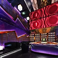 Modern Bar Interior With Neon Lights Purple And Red Lighting And Sofa Seating
