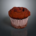 Chocolate Muffin With Cracked Surface In White Paper Liner On Gray Background