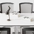 White Conference Table With Four Mesh Back Chairs Red Seats And Metal Legs
