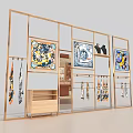 Elegant Display Space With Golden Frame Racks Colorful Scarves Decorative Paintings And Black Vases