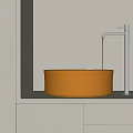 Modern Golden Washbasin with Black Faucet and Flowing Water on White Countertop