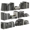 Stacked Books and Magazines with Different Sizes in Vertical and Horizontal Arrangements