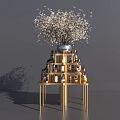 Gold Multi tiered Liquor Cabinet With White Flower Vase And Various Liquor Bottles