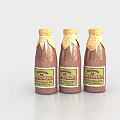 Three Natural Spice Bottles with Transparent Glass and Yellow Caps Filled with Brown Powder Seasoning