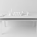 Light Wooden Desk with Pink Legs Stationery Colorful Paint Bottles Scissors Pencils and Paper