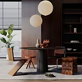 Modern Dining Table Set With Round Top Black Base Chairs Pendant Lights And Green Plant