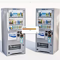 Public Facility Two Stainless Steel Vending Machines Dispensing Various Beverages