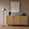 Modern Wooden Console Cabinet With Drawers Doors And Wheels Featuring Floor Lamp Vase And Artwork