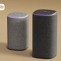 MI Smart Speakers With Fabric Material And Purple Indicator Lights In Cylindrical Design
