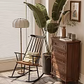 Stylish Accent Chair with Pillow by Floor Lamp Large Plant and Dresser Near Window Blinds