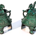 Traditional Green Ceramic Vessels Featuring Animal Head Design Spiral Patterns Three Legs and Decorative Ornaments