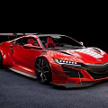 Red Sports Car With Sleek Aerodynamic Body Large Alloy Wheels And Rear Spoiler