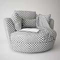Comfortable Beige Single Sofa with Purple Pillow Gray Throw Blanket and Open Magazine