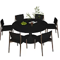 Modern Round Dining Table and Chair Set with Green Fruits Bowl and Plant Vase