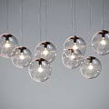 Multiple Modern Transparent Glass Ball Pendant Lights Hanging With Illuminated Bulbs