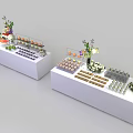 White Display Tables With Assorted Food Items And Fresh Floral Decorations