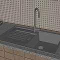 Modern Kitchen Sink With Faucet On Granite Countertop Near Fruit Bowl And Perforated Wall