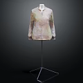 Stylish Long Sleeved Coat With Light Green And Beige Floral Pattern On Mannequin Stand