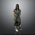 A Woman In Green Floral Dress Holding Green Bag With White Shoes Against Gray Background