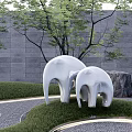 White Abstract Elephant Sculpture in Outdoor Garden With Green Grass And Gray Stone Wall