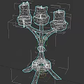 Sculpted Metal Candelabra Design with Three Lit Candles and Wax Drips
