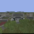 Modern School Buildings With Sports Field Greenery And Surrounding Road Interchange