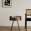 Round Wooden Side Table With Open Magazine Glass Near Rattan Backrest Chair By Light Wall