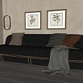 Black Leather Sofa With Throw Pillows Blanket And Framed Botanical Prints In Living Room