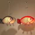 Red And Gold Fish Shaped Pendant Lights Hanging In Home Interior 3d model