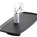 Black Rectangular Coffee Table with Floral Patterned Vase and Small Branches in Interior