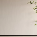 Beige Textured Wall with Green Bamboo Branch and Fresh Leaves