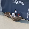 3D Designed Curved Textured Brown Reception Desk With Receptionist In Modern Welcome Lobby