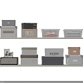 Storage Baskets And Boxes In Various Colors On Shelves For Home Organization