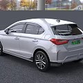 White Honda Sedan With Modern Exterior Design And Green License Plate